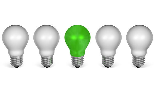 istock Green light bulb in row of white ones. Front view 467317053