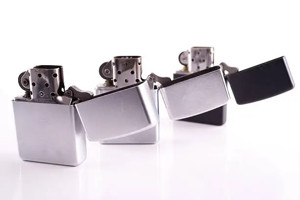 Photo of Silver metal zippo lighters on white