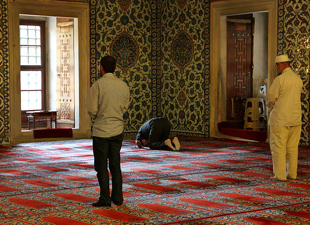 Selimiye Mosque Edirne, Turkey - October 7, 2012: Muslims prays in Selimiye Mosque in Edirne, Turkey. religious dress stock pictures, royalty-free photos & images