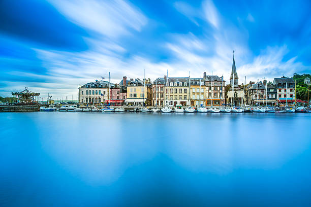 Honfleur famous village harbor skyline and water reflection. Normandy, France, Europe. Long exposure.