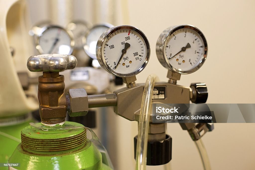 Gas Bottle with Pressure Indicator This image shows's a pressure indicator and a valve on a gas bottle. Physical Pressure Stock Photo