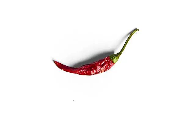 Red dried chili pepper on white.