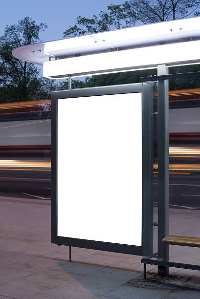 istock Bus stop with an advertising board at night 467321949