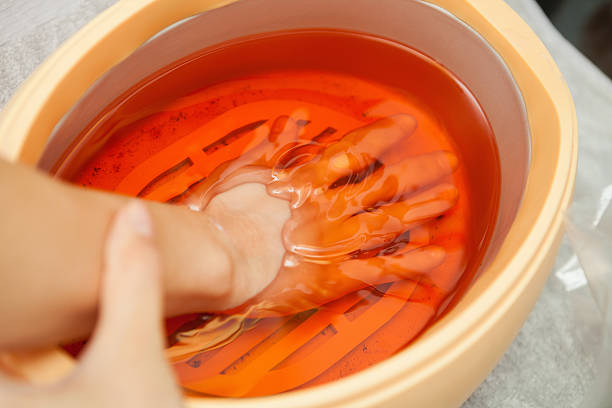 Spa salon. Manicure. Paraffin hand bath.