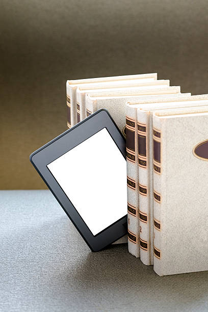 Ebook and old books on table stock photo