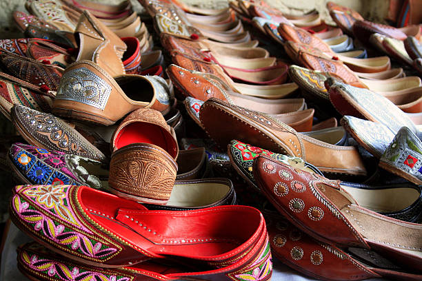 istock Indian handmade embroidered shoes on a souvenire stall 467322597