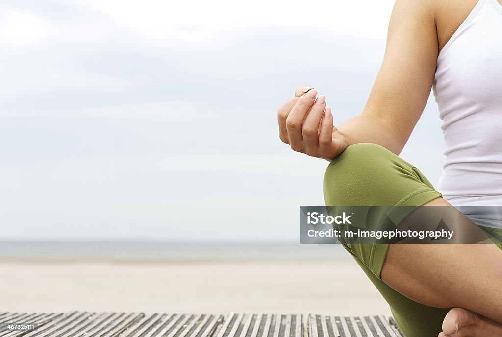 Portrait of female yoga hands at the beach Horizontal portrait of female yoga hands at the beach Beach Stock Photo