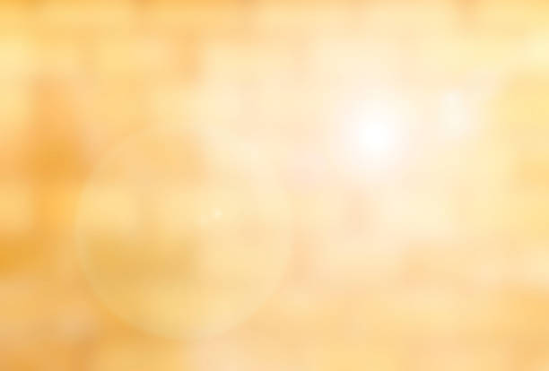 istock Blurred brick wall in orange yellow tone abstract with flare 467325758