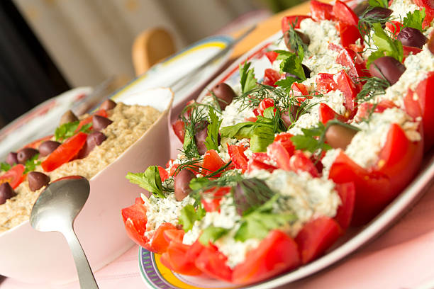 Close-up of stuffed tomatoes with cheese and eggplant salad