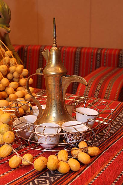 Arabic coffee pot with dates stock photo