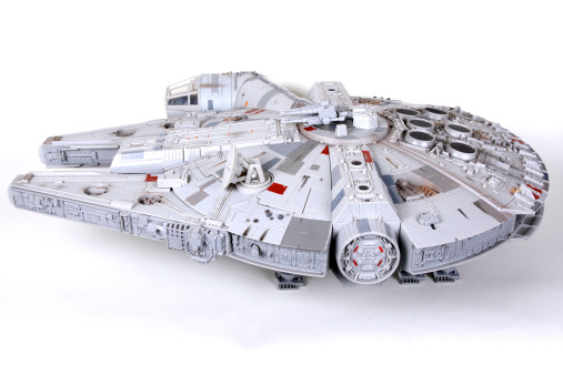 Vancouver, Canada - January 27, 2014: A toy Millenium Falcon, from the Star Wars movie franchise, on a white background. The toy is made by Hasbro