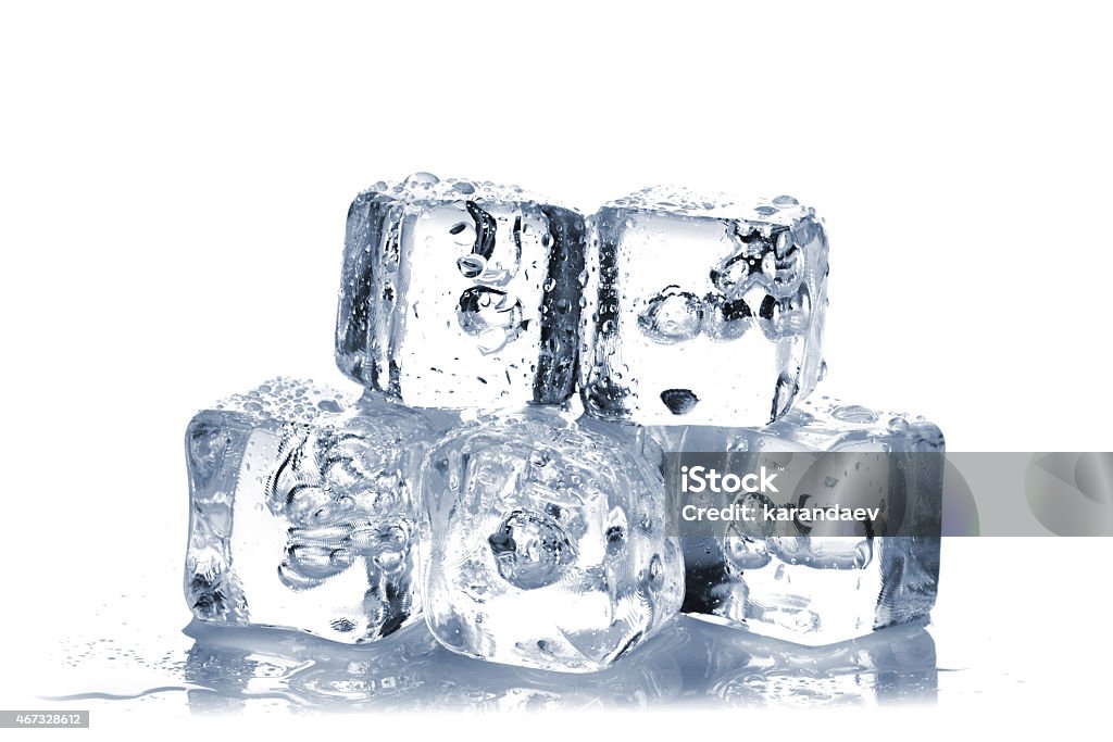 Melting ice cubes Melting ice cubes with air bubbles inside on white background 2015 Stock Photo