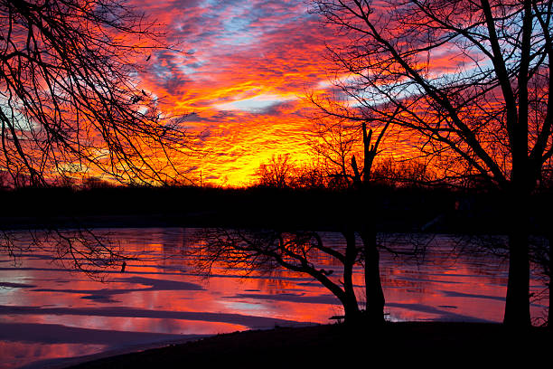 Beutiful sunset over a frozen lake stock photo