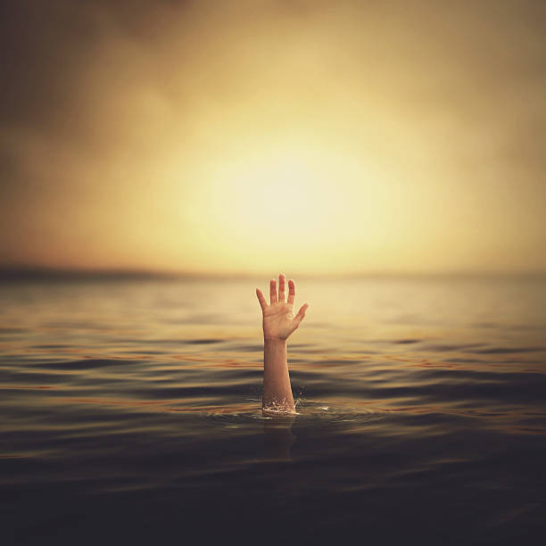 istock Hand coming out of the water 467333413