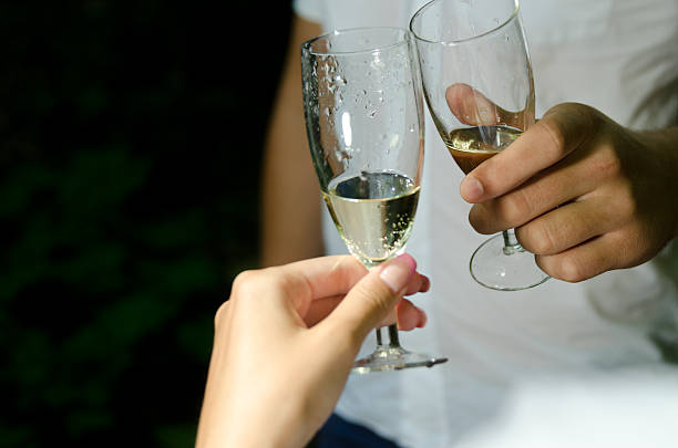 istock Happy couple drink wine and clinking glasses. 467333495