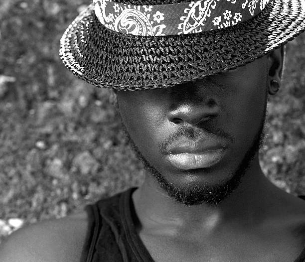istock African american man with hat covering face 467334564