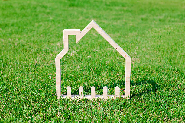 istock House icon in green field 467335052