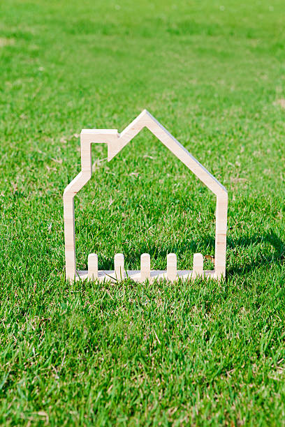 istock House icon in green field 467335054