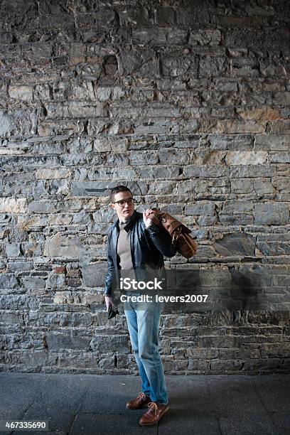 Handsome Man Walking In Dublin Ireland Stock Photo - Download Image Now - Fashion, Full Length, Looking Over Shoulder