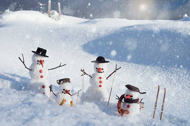 istock Snowman family team 467338346