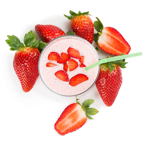 istock strawberry smoothie in a glass and berries , top view 467339096