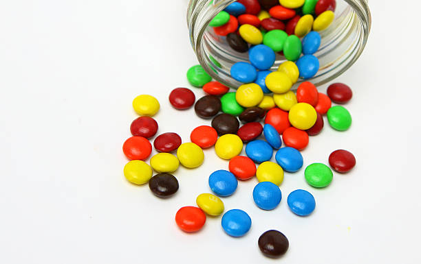 istock Colorful sugar-coated chocolate smarties in a glass jar 467339334