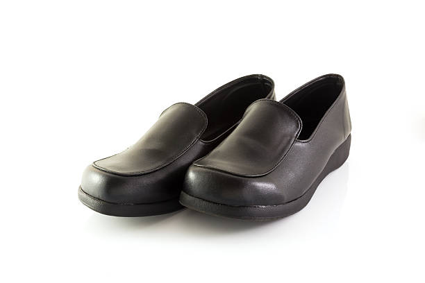 istock Black leather shoes on white background 467339448