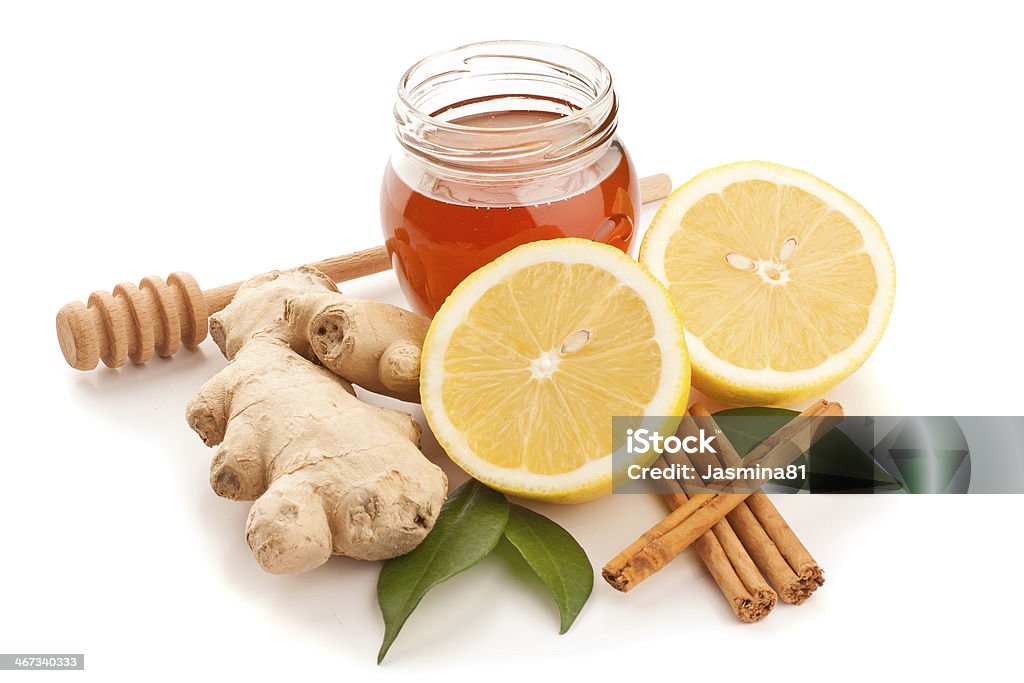 Honey, cinnamon, ginger and lemon Honey, cinnamon, ginger and lemon isolated on white Bean Stock Photo