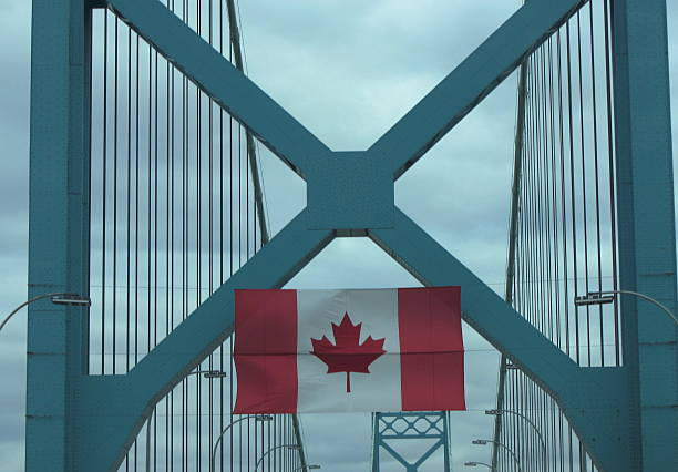 istock Canadian flag hanging on Ambassador bridge. 467342237
