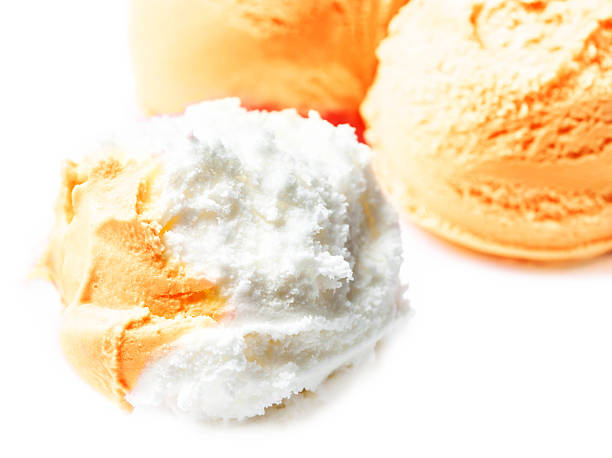 istock Vanilla and  Orange Fruit  Ice Cream Balls Macro. Beautiful Scoo 467342594