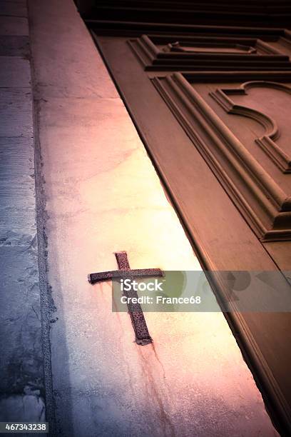 Iron Cross Snuggled In Stone Stock Photo - Download Image Now - 2015, Catholicism, Christianity