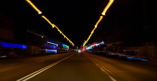 istock car lights on highway by night,abstract light trace background 467343268