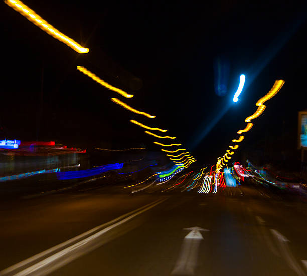 istock car lights on highway by night,abstract light trace background 467345798