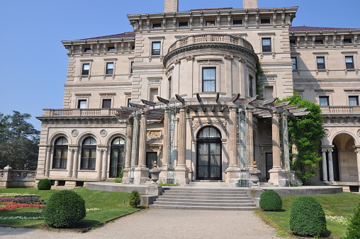 Newport, RI, USA - July 19, 2013: The Breakers Mansion in Newport, Rhode Island. The mansion is a national historic landmark built by Cornelius Vanderbilt of the Gilded Age.
