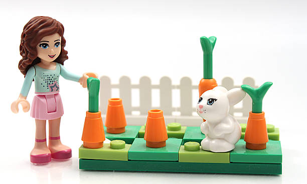 lego mädchen mit bunny - lego construction toy isolated on white isoalted stock-fotos und bilder