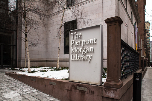 New York City, New York, USA - February 21, 2015: View from sidewalk of historic Pierpont Morgan Library museum in Midtown Manhattan.  This landmark was founded to house the private library of J. P. Morgan in 1906