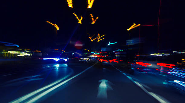 istock car lights on highway by night,abstract light trace background 467350018