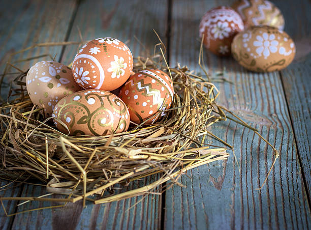 istock Easter eggs in the nest on rustic wooden background 467350022