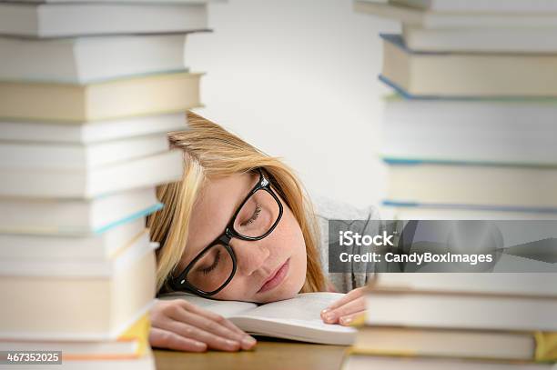 Student Girl Sleeping Between Pile Of Books Stock Photo - Download Image Now - Adolescence, Adult, Beautiful People