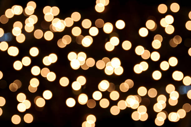 istock Golden bokeh photo on black background. 467353681
