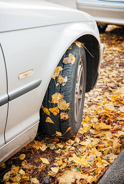 istock Car winter tire in autumn 467354211