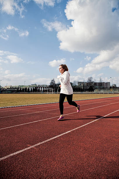 istock Young woman running 467354966