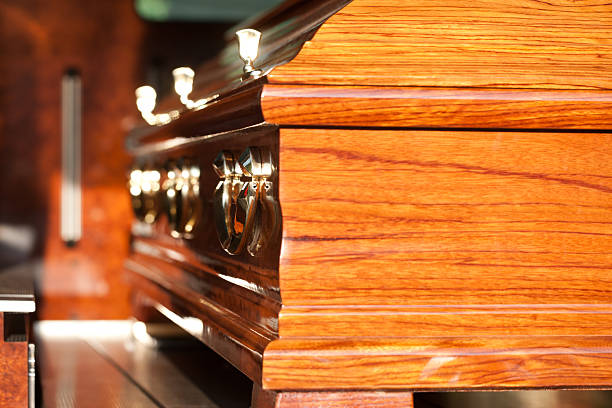 istock Funeral with coffin in hearse 467356941