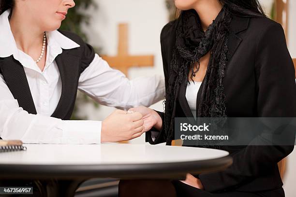 Female Mortician Comforting And Advising A Woman In Black Stock Photo - Download Image Now