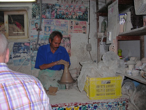 Nabeul, Tunisia - September 26, 2008: Worker in a pottery shop in Nabeul, center of the Tunisian pottery industry.