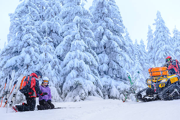 istock Ski patrol helping woman with broken arm 467364737