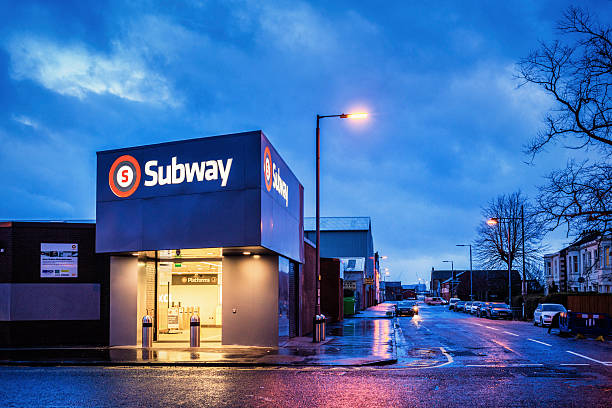 Ibrox Subway Station Glasgow, UK - January 26, 2014: The newly-refurbished Ibrox subway station on the south side of Glasgow city centre on a rainy evening. ibrox stock pictures, royalty-free photos & images