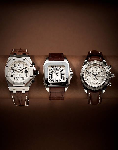 trois montres de luxe dans la suite - watch wristwatch clock hand leather photos et images de collection