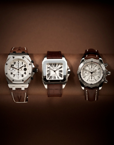 Amsterdam, Netherlands - March 3, 2009: Three luxury watches in a row