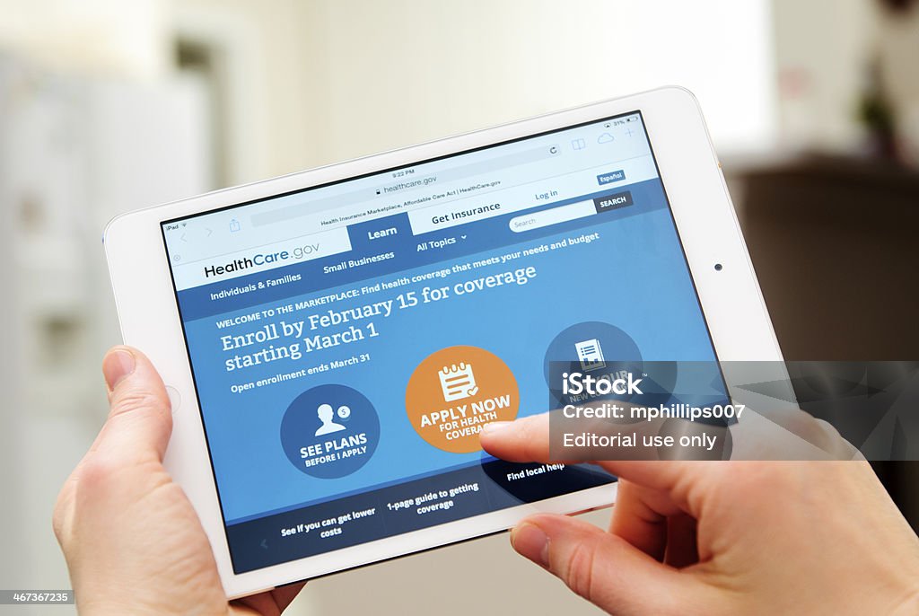 Healthcare.gov Alpharetta, GA, USA - February 2, 2014 - A user applying to the U.S. Governments HealthCare.gov website on a ipad with the online message stating the online application deadline is February 15th. Claim Form Stock Photo